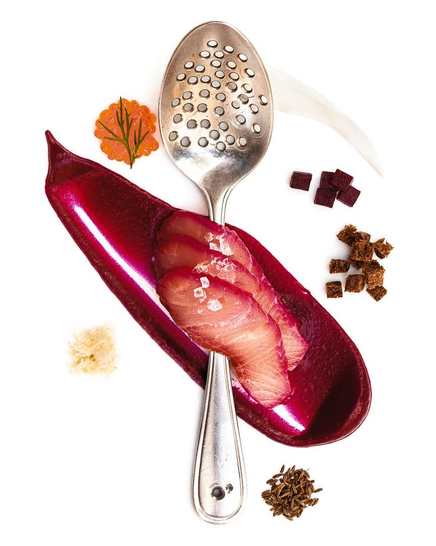 Spoonfuls of Inspiration: Dave Mawhinney - Precision and Control Spoonful portrait of Chef Dave Mawhinney titled Precision and Control, featuring hamachi, beets, and caraway seeds in a personally perforated straining spoon.