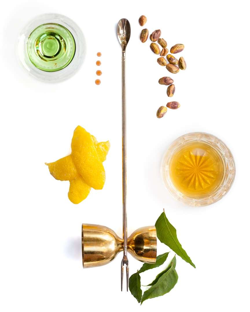 Spoonfuls of Inspiration: Jillian Vose - Cocktail Craft Spoonful portrait of Mixologist Jillian Vose featuring pistachio syrup, fresh curry leaves, and Irish whiskey with a trident bar spoon.