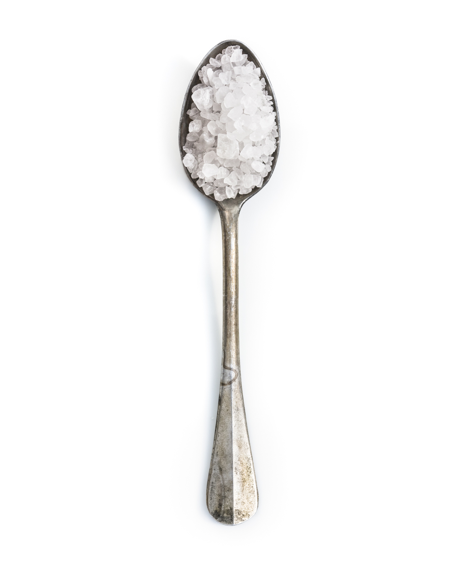 Spoonfuls of Inspiration: Sadie Herrig - Salt to Taste Spoonful portrait of Grandma Sadie Herrig featuring pure sea salt in a small, hollow aluminum heirloom spoon.